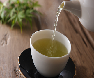 ayr-tea green tea being poured into a white cup - best tea blends concept image